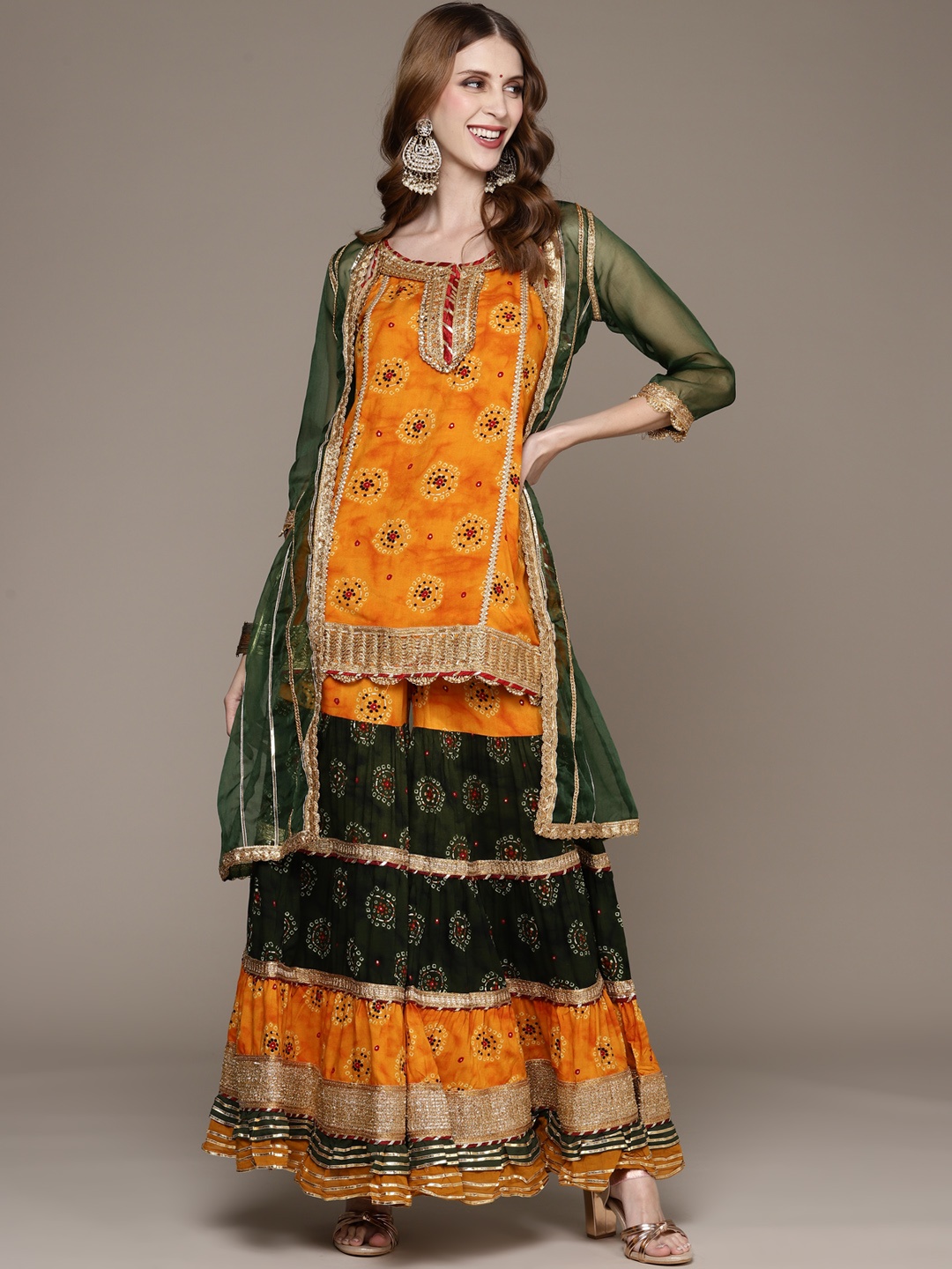 

Ishin Women Mustard Yellow Bandhani Printed Gotta Patti Kurta with Sharara & Jacket