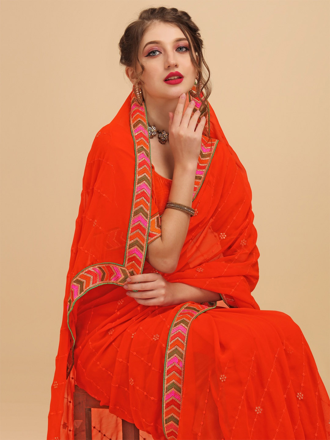 

Sangria Orange & Green Striped Embroidered Pure Georgette Saree