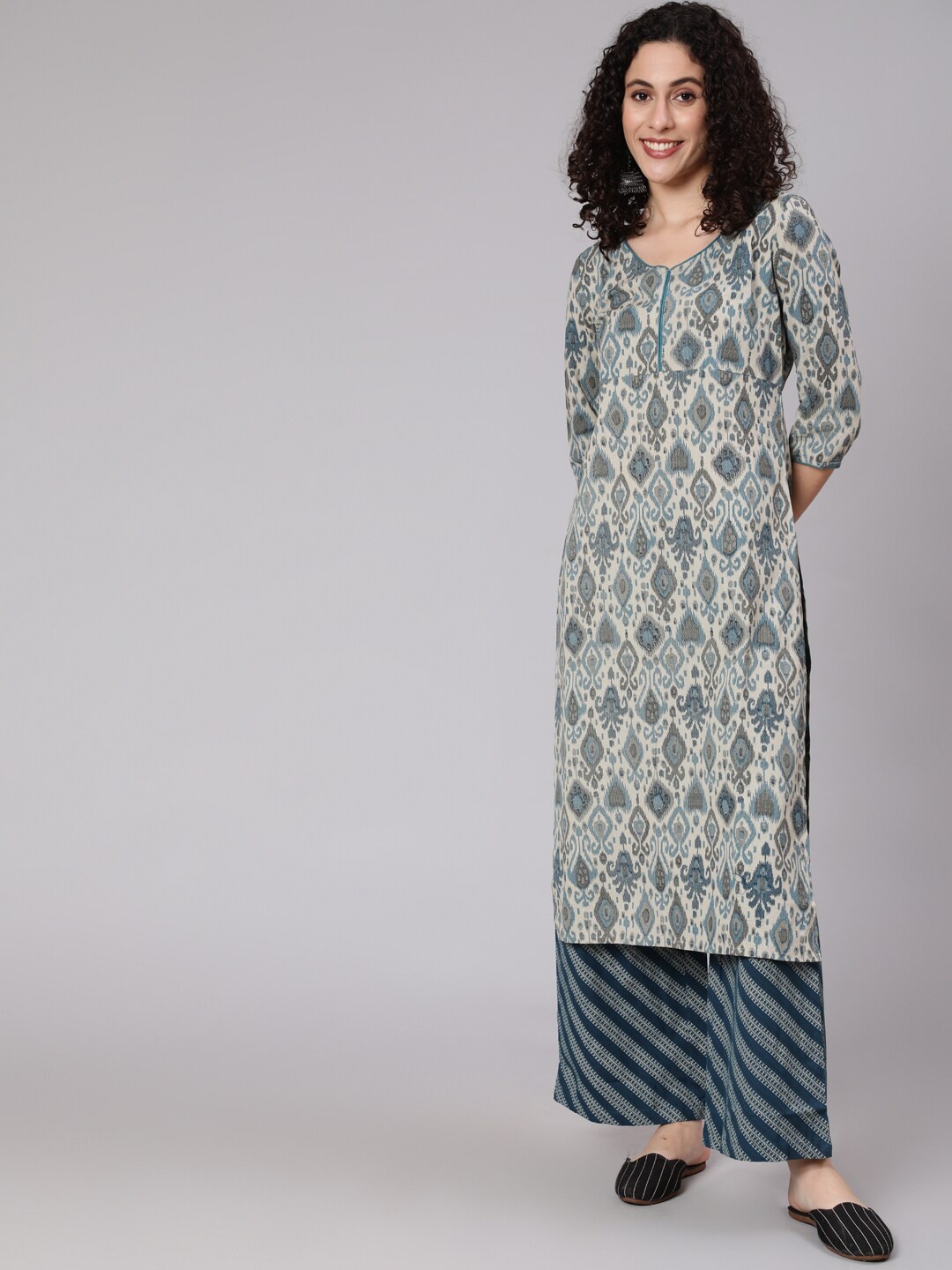 

Awadhi Women Blue Ethnic Motifs Ikat Printed Straight Kurti with Trousers