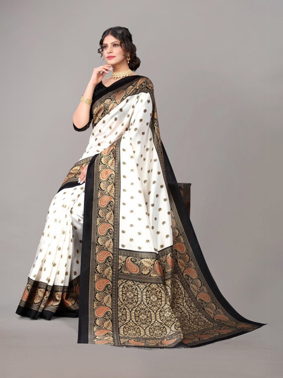 

Yashika White & Black Ethnic Motifs Art Silk Saree