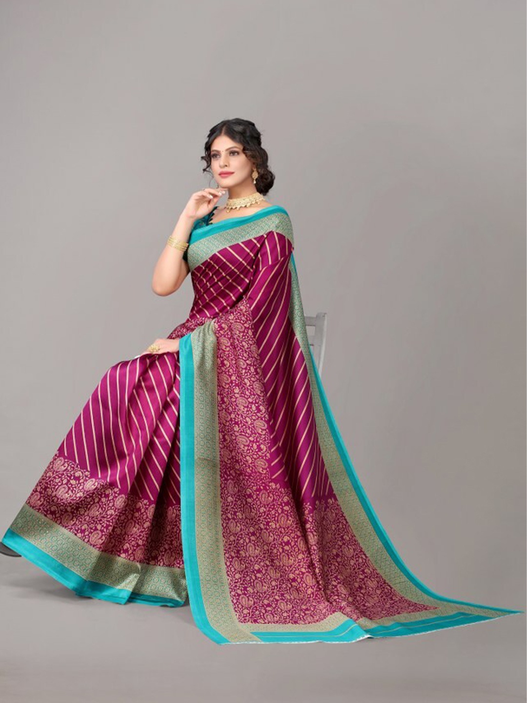 

Yashika Burgundy & Sea Green Striped Art Silk Saree