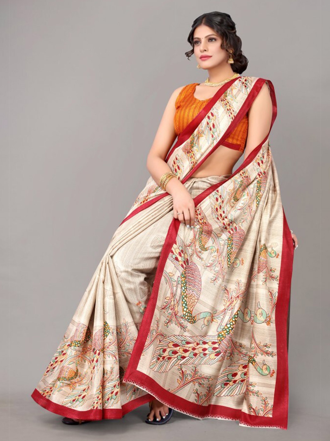 

Yashika Cream-Coloured & Red Ethnic Motifs Art Silk Saree