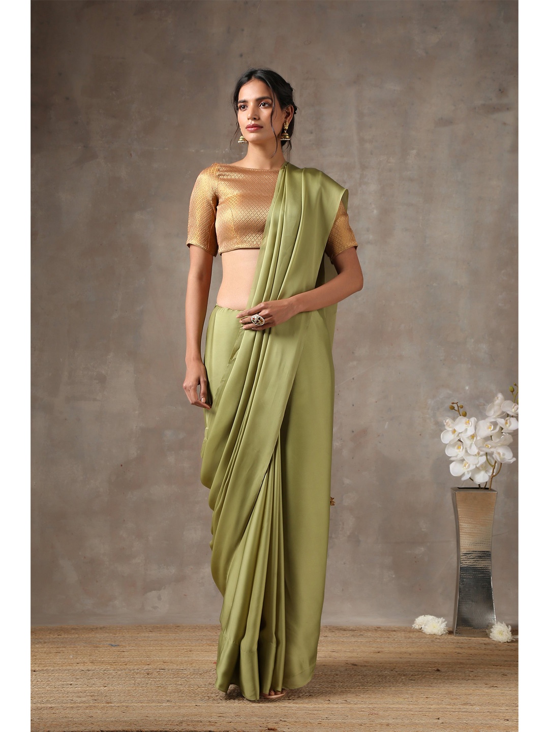 

Swtantra Green Solid Satin Saree
