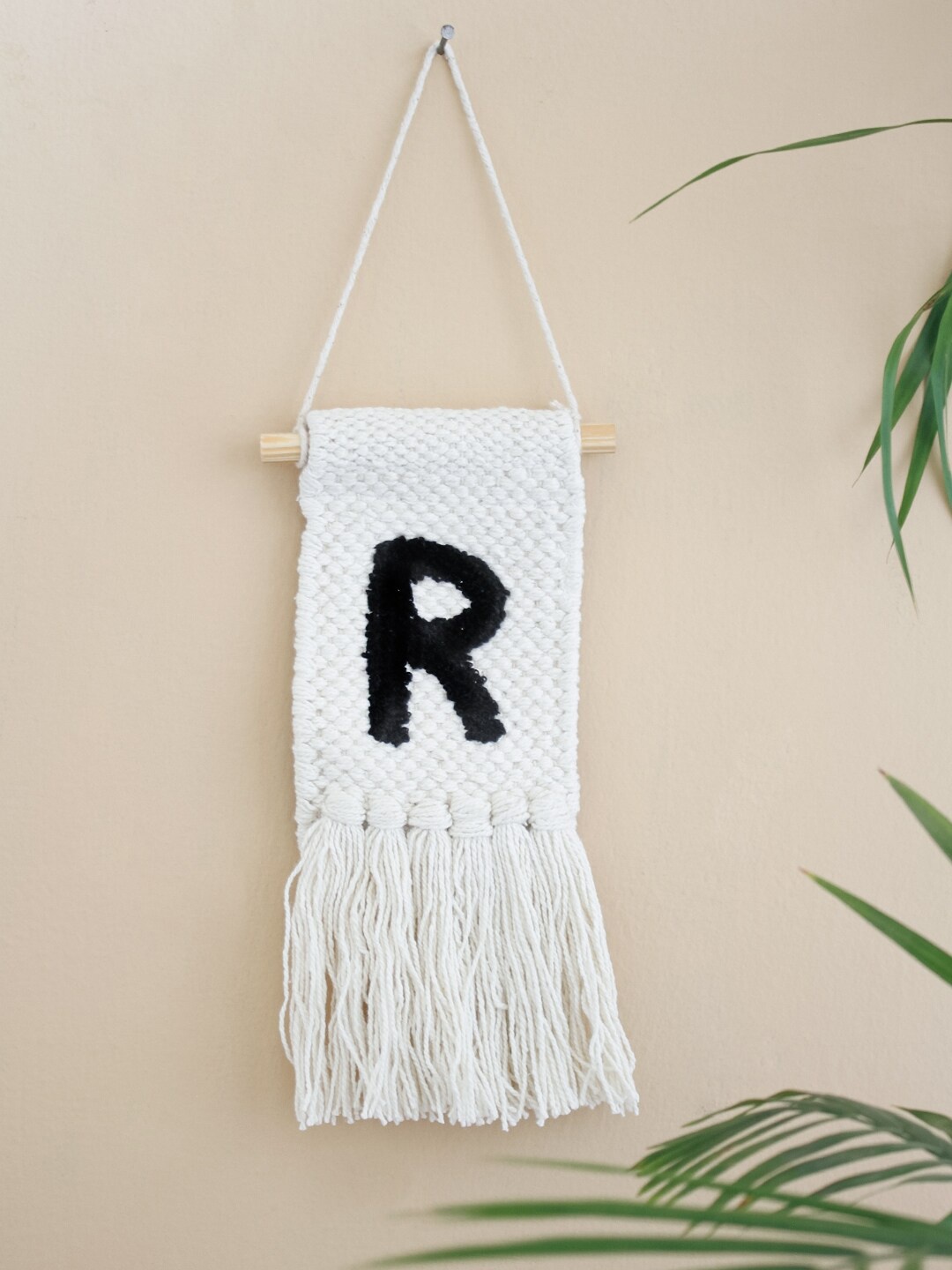

The Wishing Chair Off White & Black Solid Monogram Mini Wall Hanging