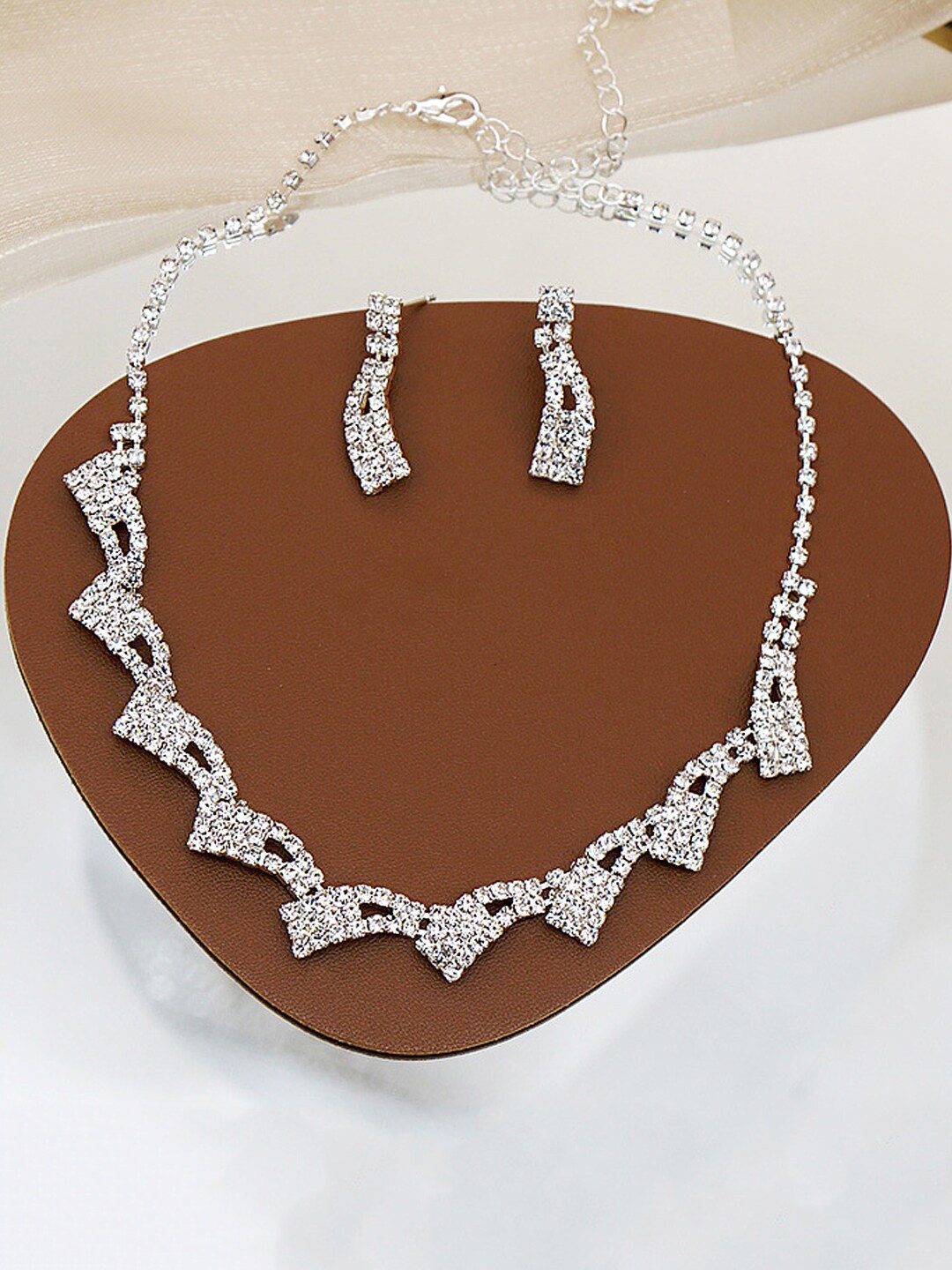 

Yellow Chimes Silver-Plated & White Crystal Studded Jewellery Set