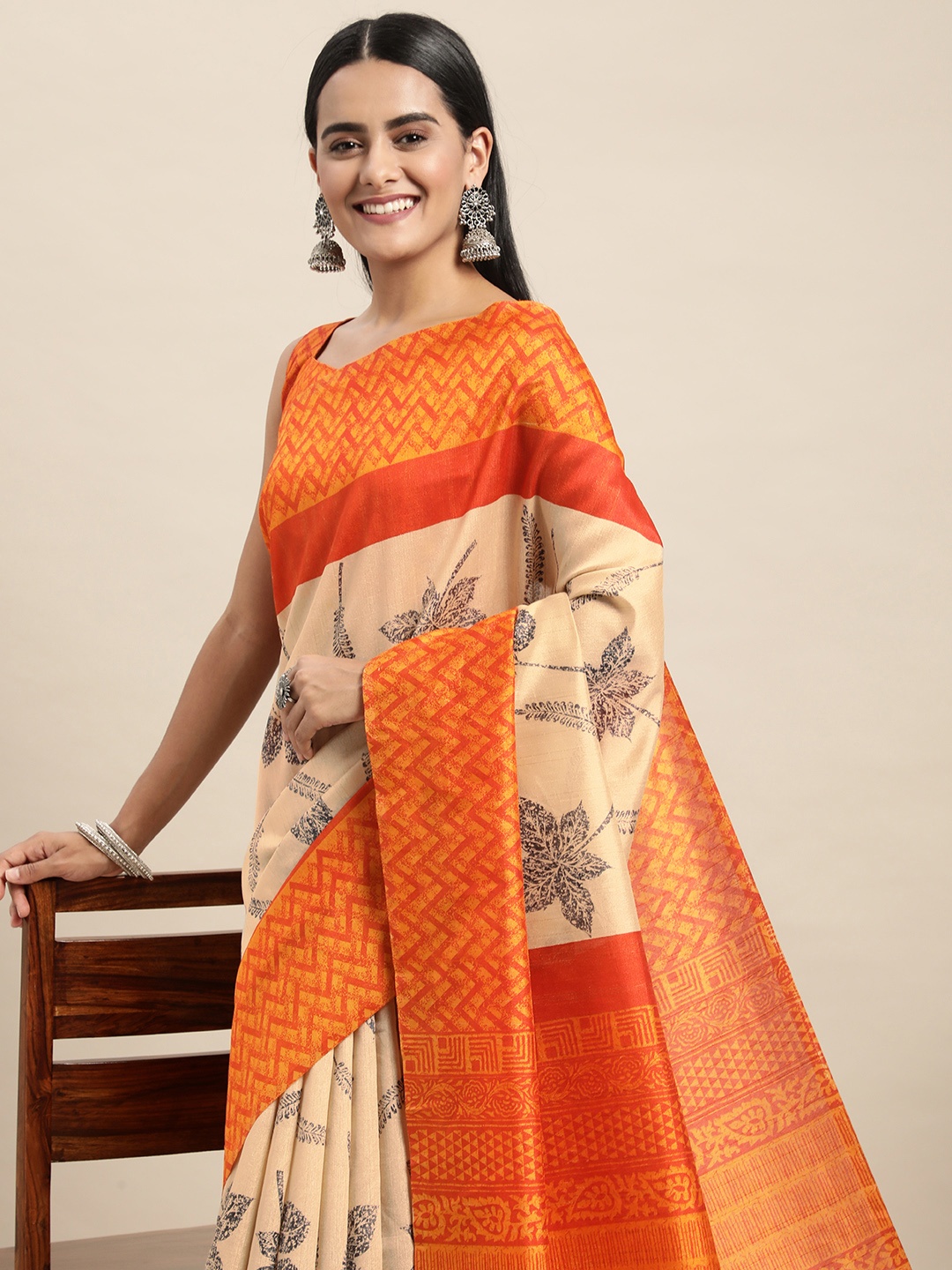 

Saree mall Cream-Coloured & Orange Floral Printed Taant Sarees