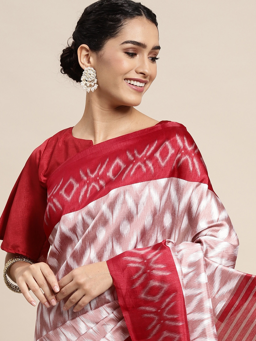 

Saree mall Off White & Red Ikat Printed Sarees