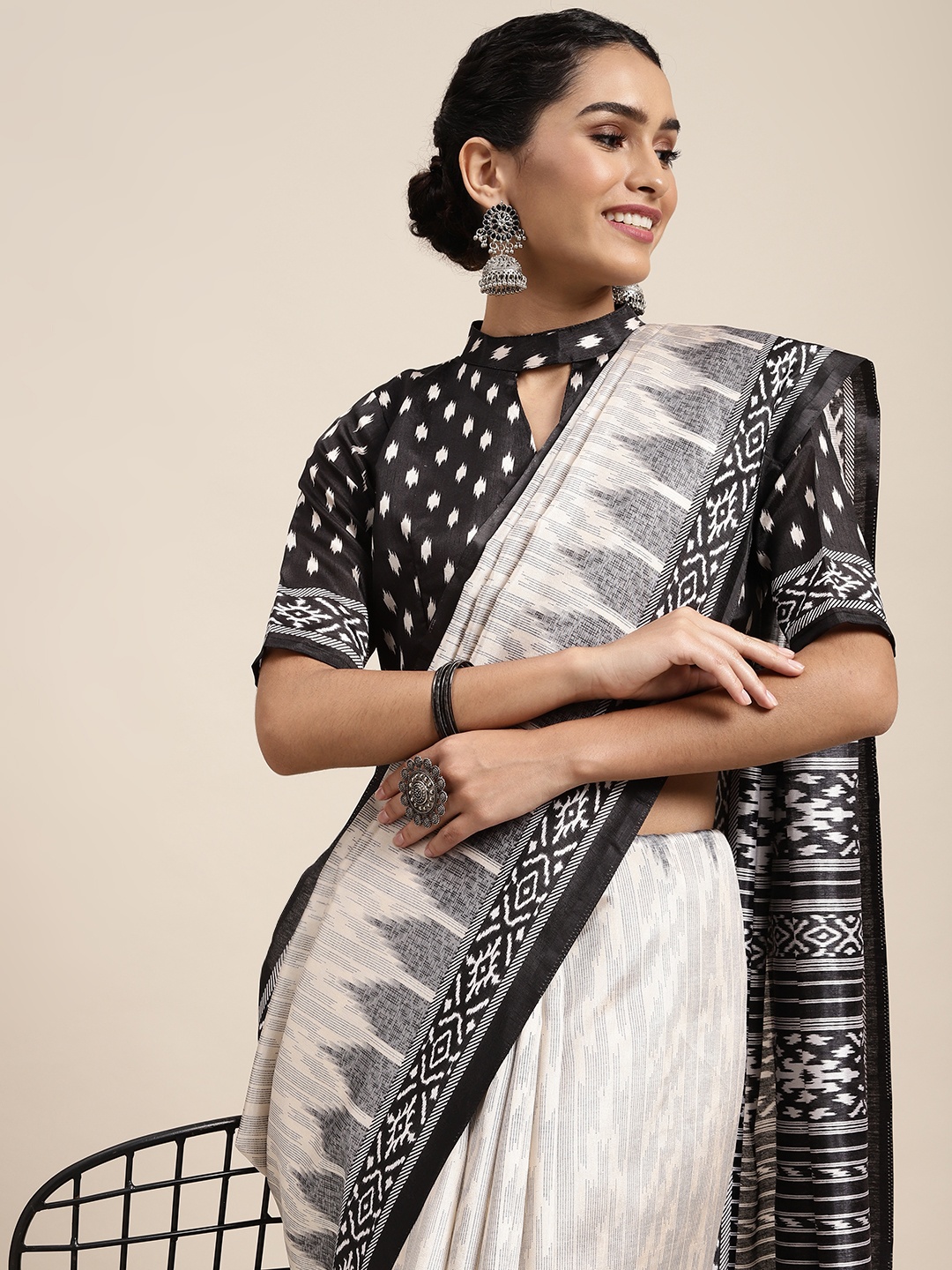 

Saree mall Off White & Black Ikat Printed Sarees