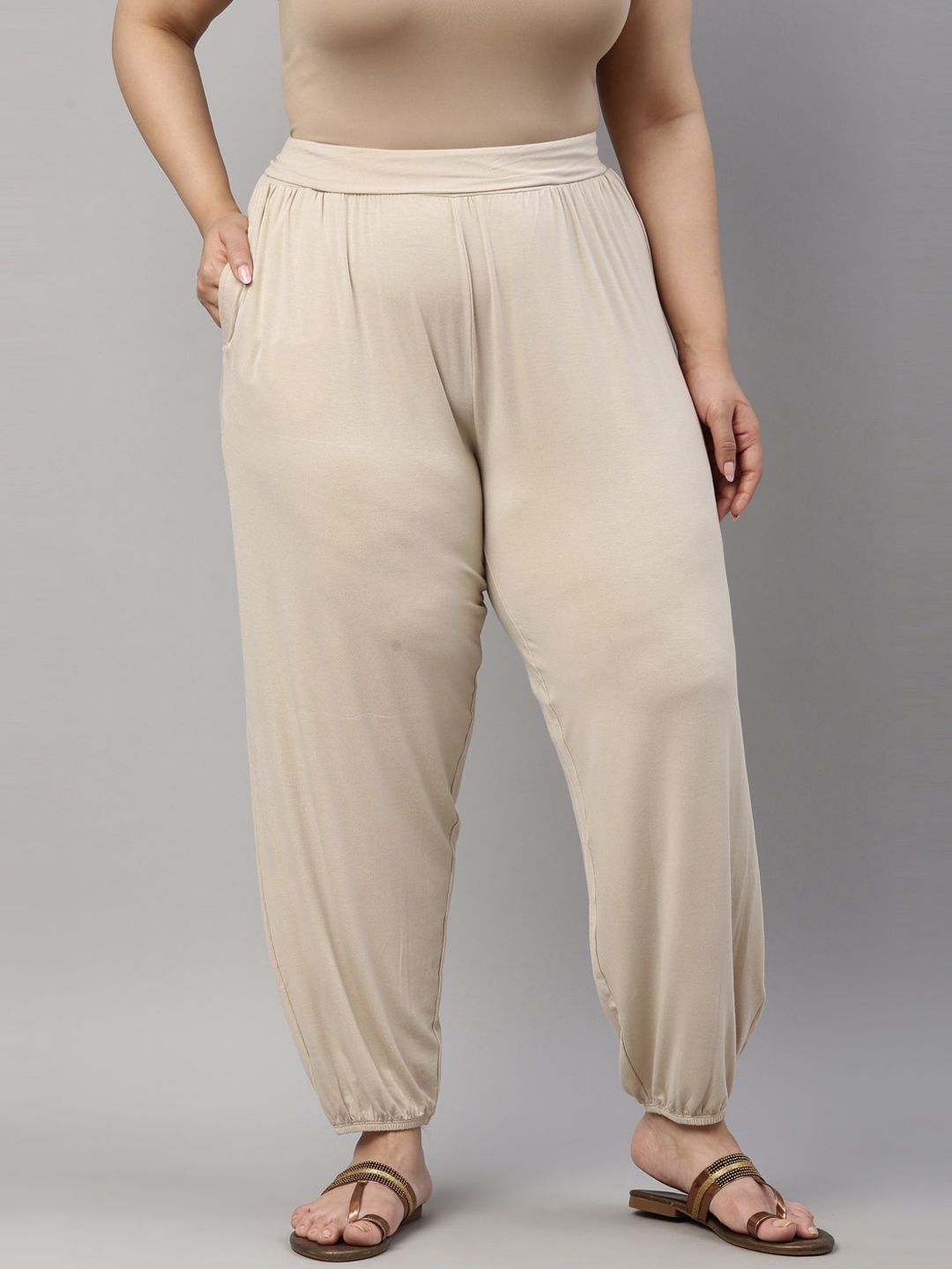 

Go Colors Women Beige Solid Loose-Fit Harem Pant