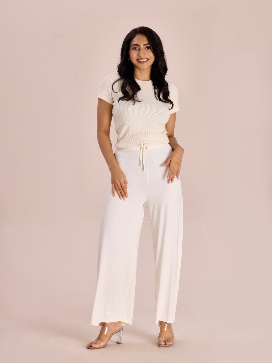 

Go Colors Women Off White Solid Mid Rise Palazzos