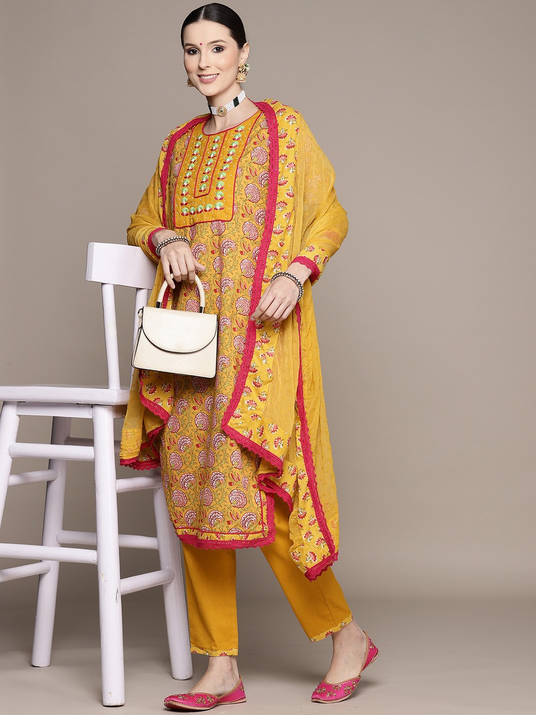 

Ishin Women Mustard Yellow Floral Yoke Design Thread Work Pure Cotton Kurta with Trousers & With Dupatta
