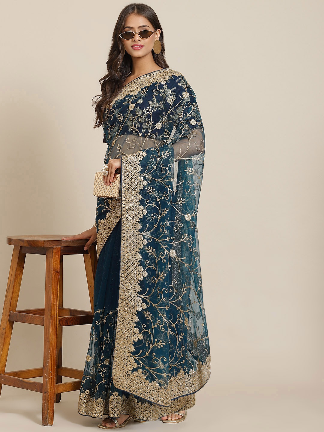 

Chhabra 555 Teal Blue & Golden Ethnic Motifs Aari Work Net Heavy Work Saree