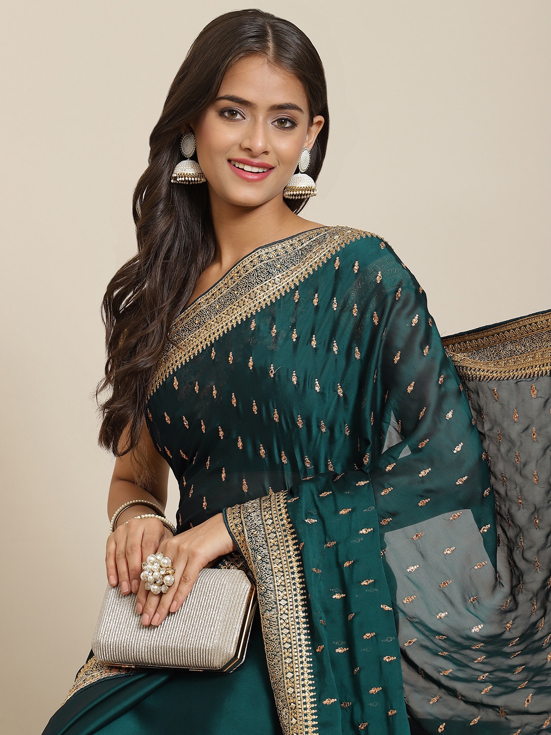 

Chhabra 555 Teal Green & Golden Ethnic Motifs Aari Work Saree