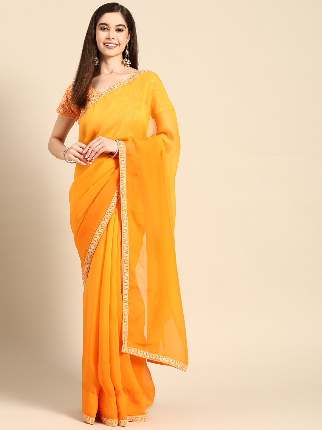

Saadgi Solid Saree With Embroidered Border, Orange