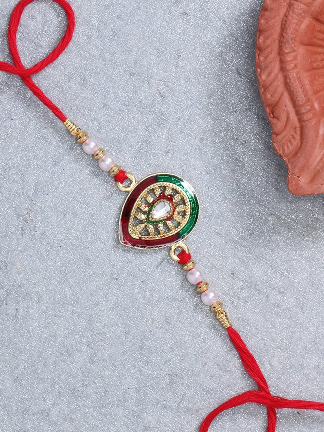 

LIVE EVIL Gold Plated Maroon Meena Work Rakhi