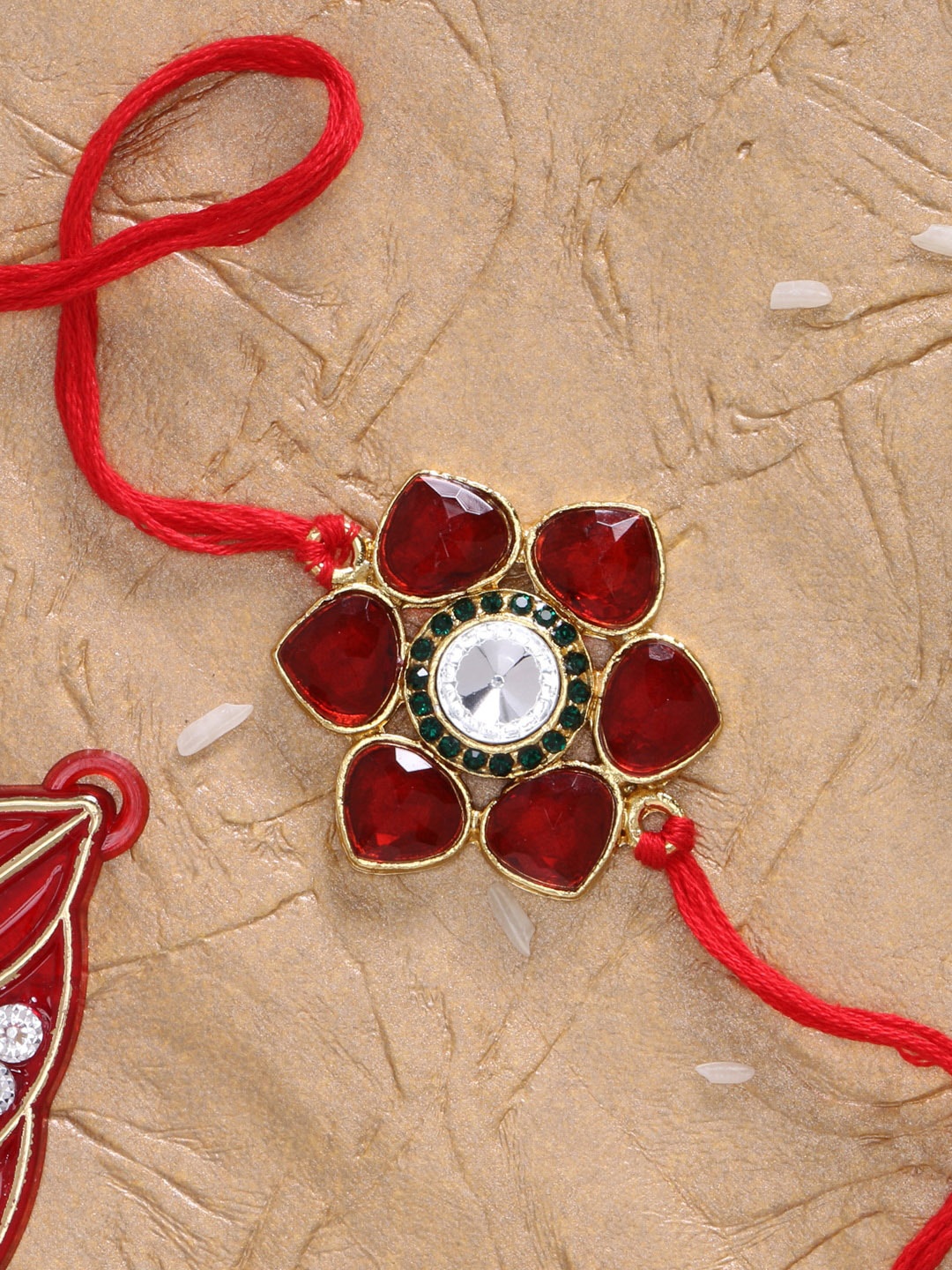 

LIVE EVIL Gold-Plated Red Stone Studded Rakhi