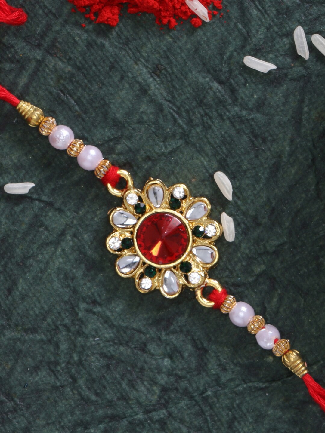 

LIVE EVIL Red Gold-plated Kundan Studded Rakhi
