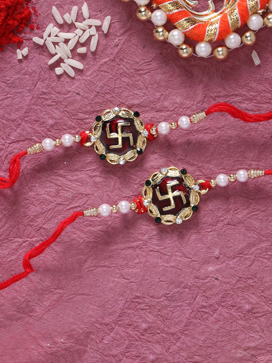 

LIVE EVIL Maroon Gold-Plated Meenakari Rakhi