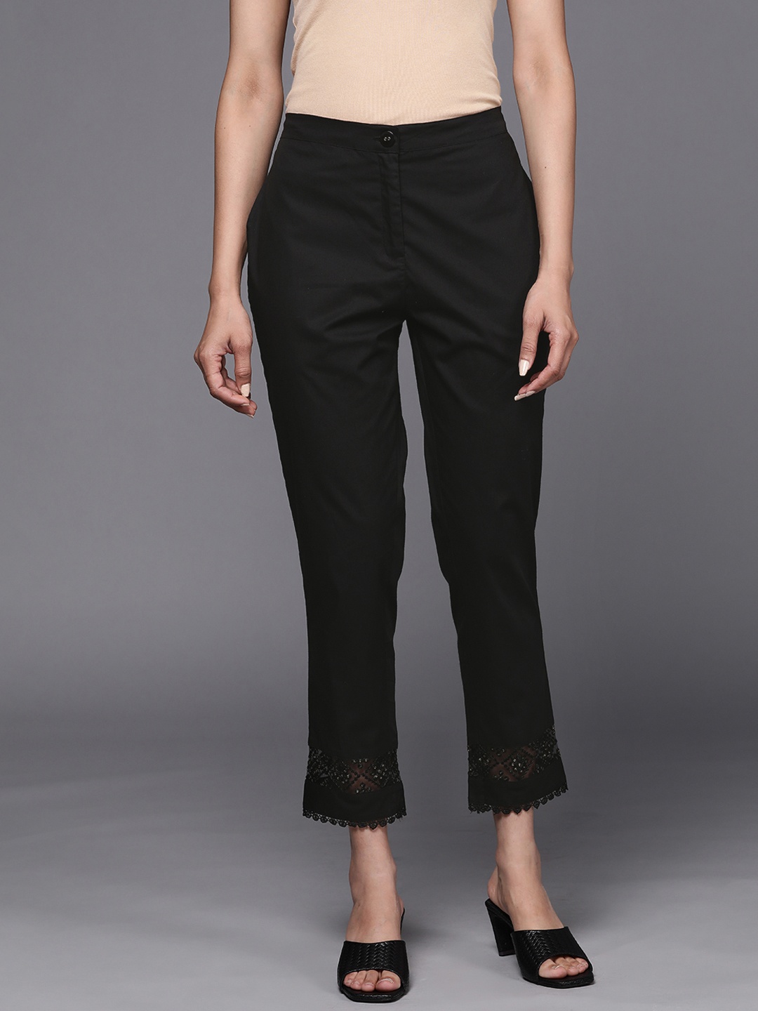 

Libas Women Black Pure Cotton Trousers with Lace Details at Hem