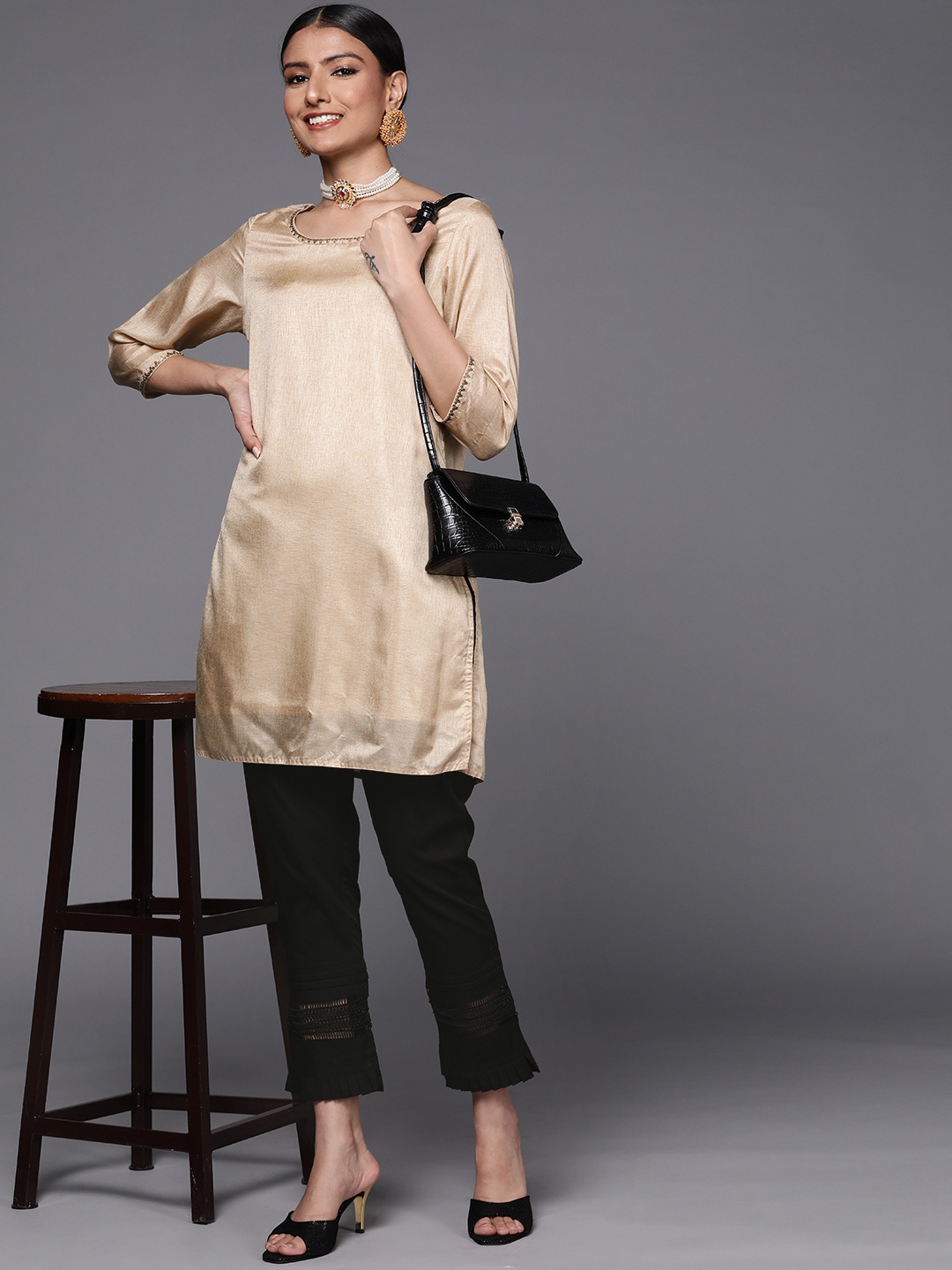 

Libas Women Black Pure Cotton Trousers with Lace Details at Hem