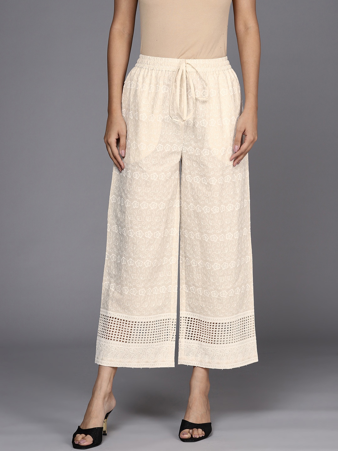 

Libas Women Beige Ethnic Motifs Hem Design Flared Ethnic Palazzos