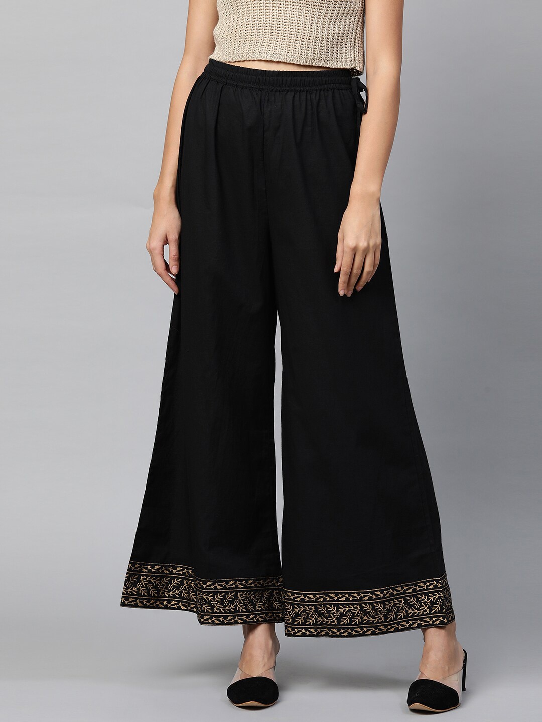 

FASHOR Women Black & Gold-Toned Ethnic Motifs Embroidered Flared Palazzos