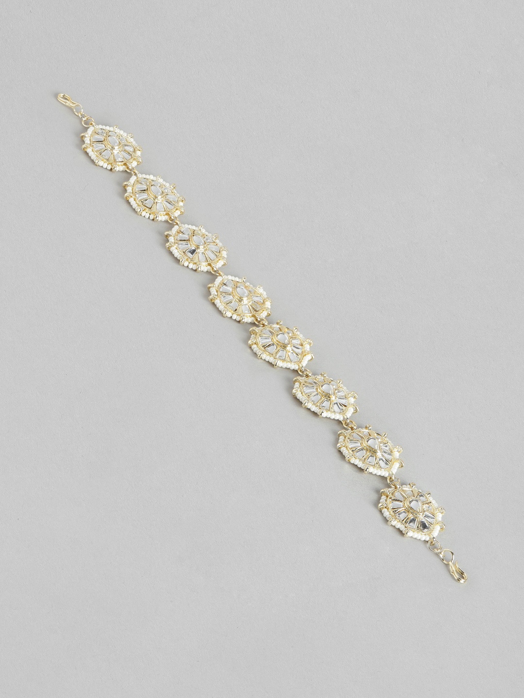 

Blueberry Gold Plated Kundan Stone Embellished Head Chain
