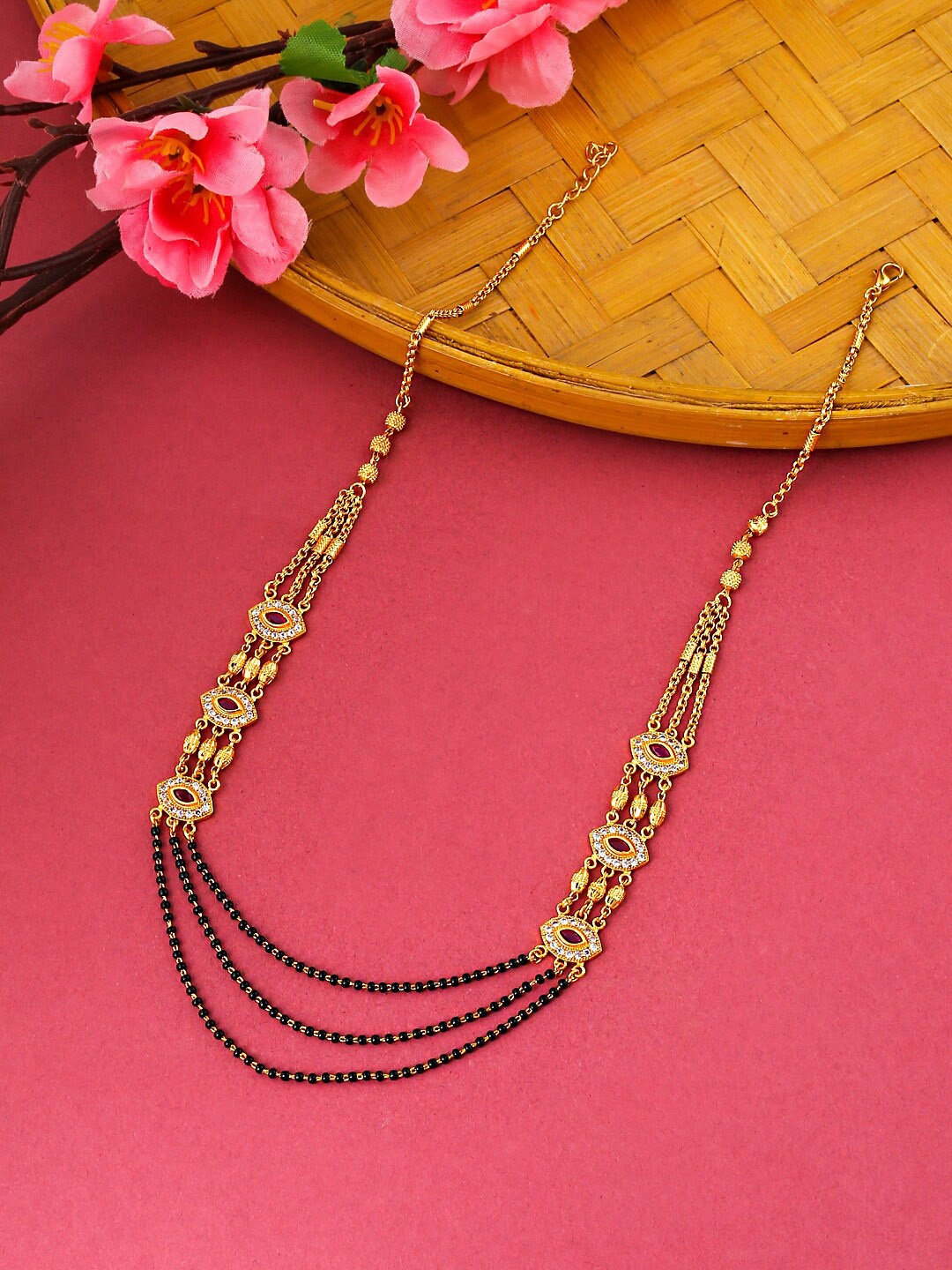 

Yellow Chimes Gold Toned Red Crystal Studded Eye Designed Mangal Sutra