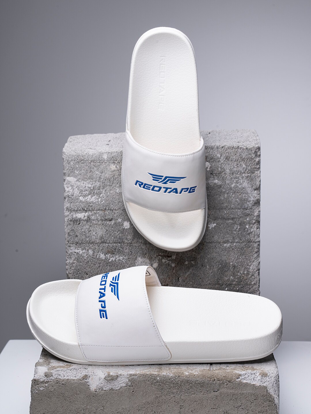 

Red Tape Men White & Blue Printed Rubber Sliders