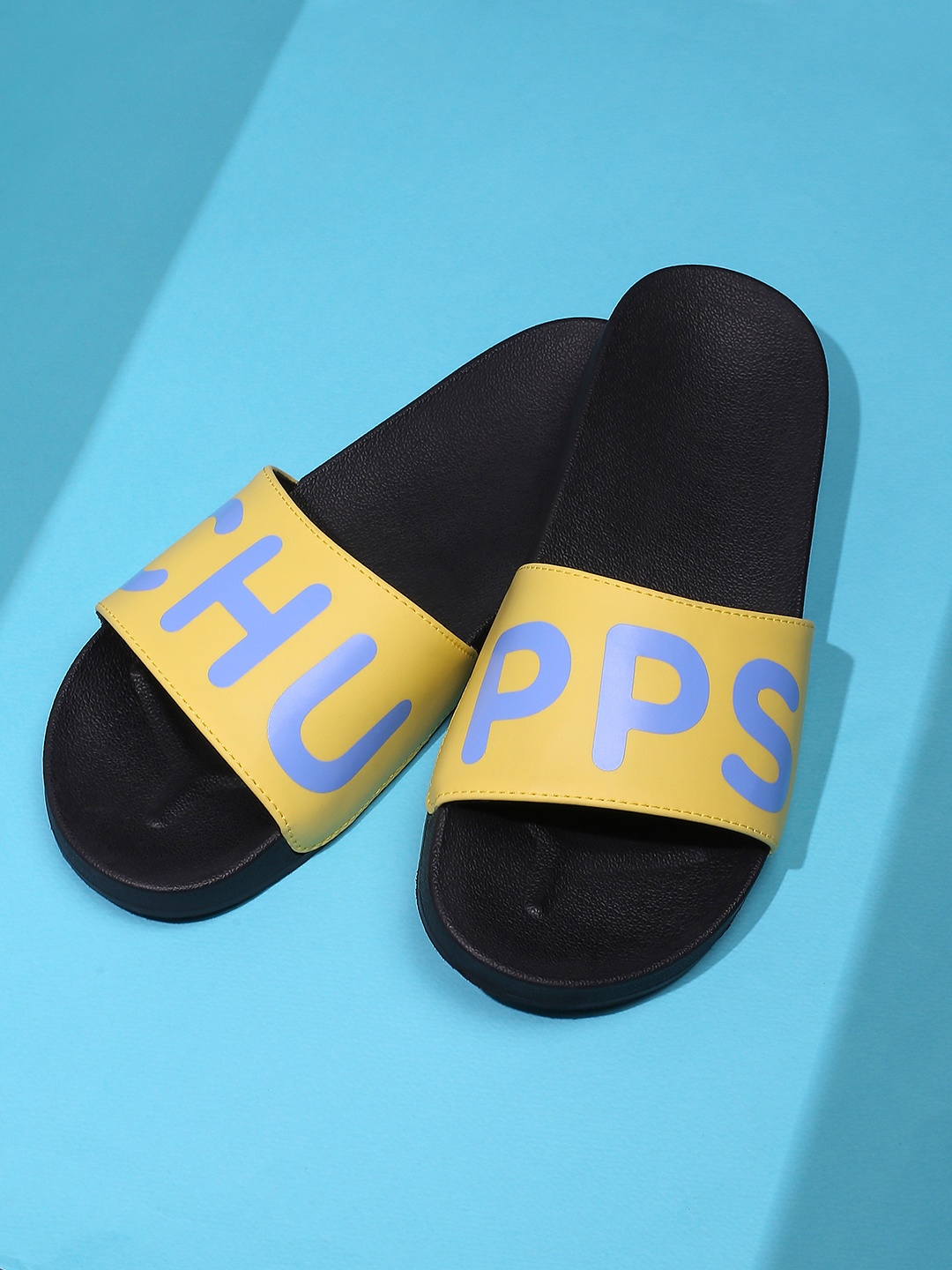 

CHUPPS Women Yellow & Black Printed Rubber Slip-On