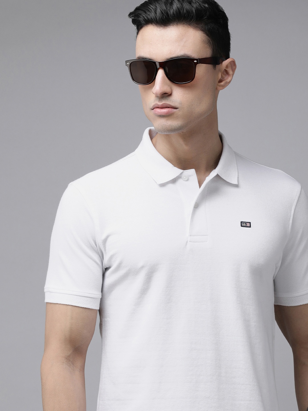 

Arrow Sport Men White Solid Short Sleeve Ribbed Polo Collar T-shirt