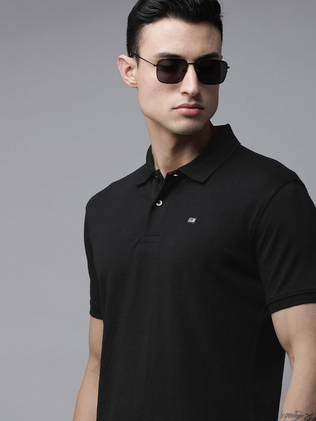 

Arrow Sport Men Black Solid Short Sleeves Polo Collar T-shirt