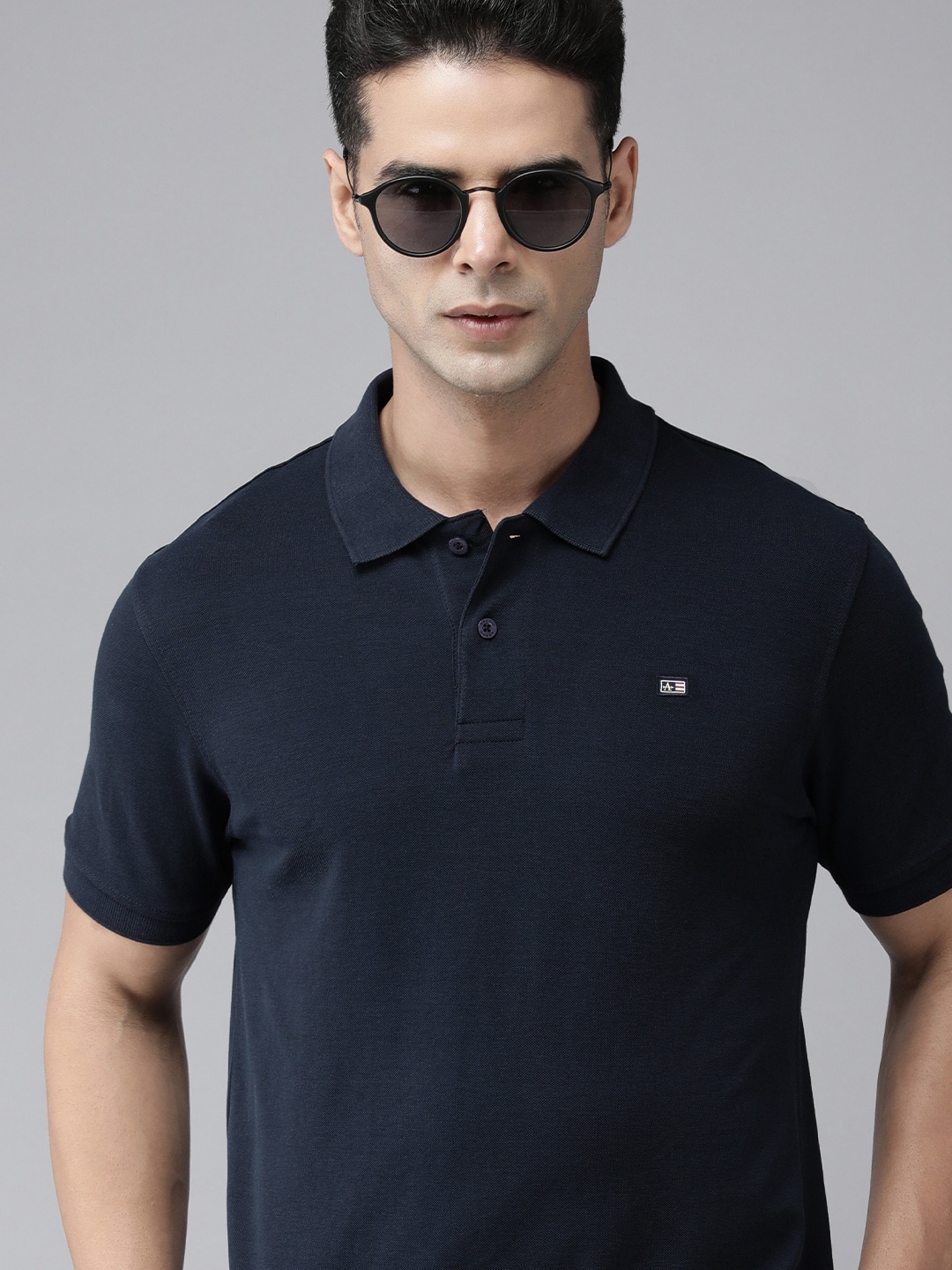 

Arrow Sport Men Navy Blue Solid Polo Collar Short Sleeves T-shirt