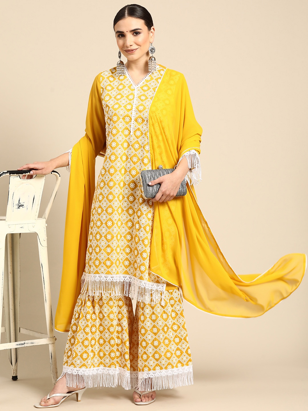 

Anouk Women Mustard Yellow & White Ethnic Motifs Embroidered Kurta with Sharara & Dupatta