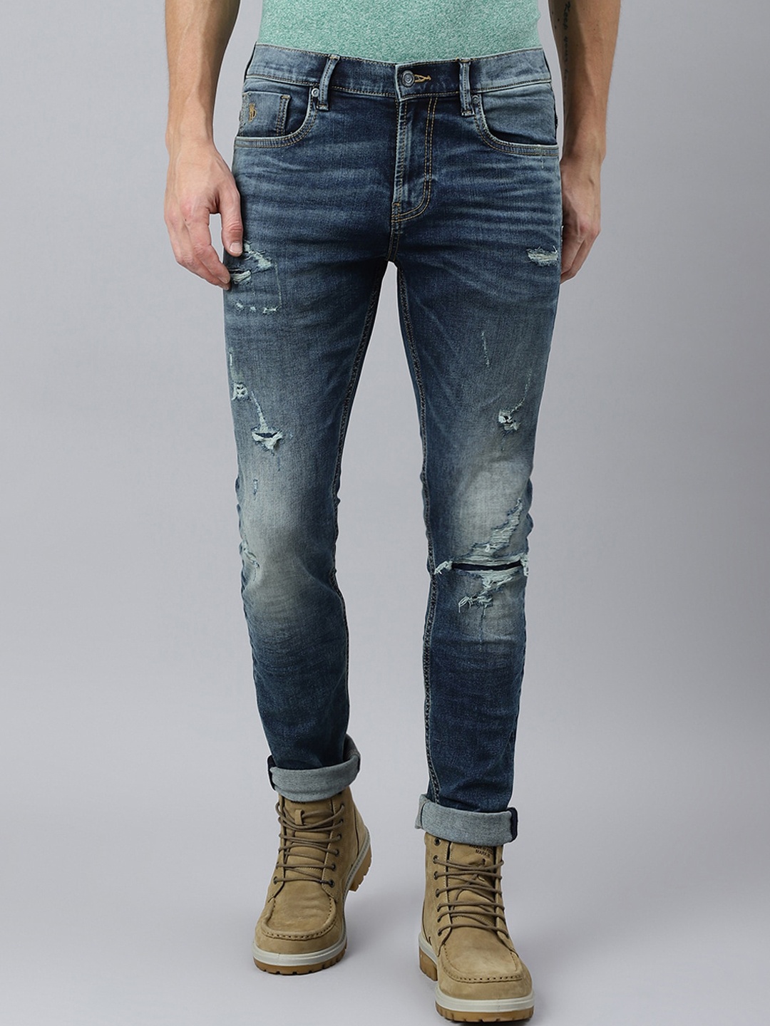 

Woodland Men Blue Mildly Distressed Light Fade Stretchable Jeans