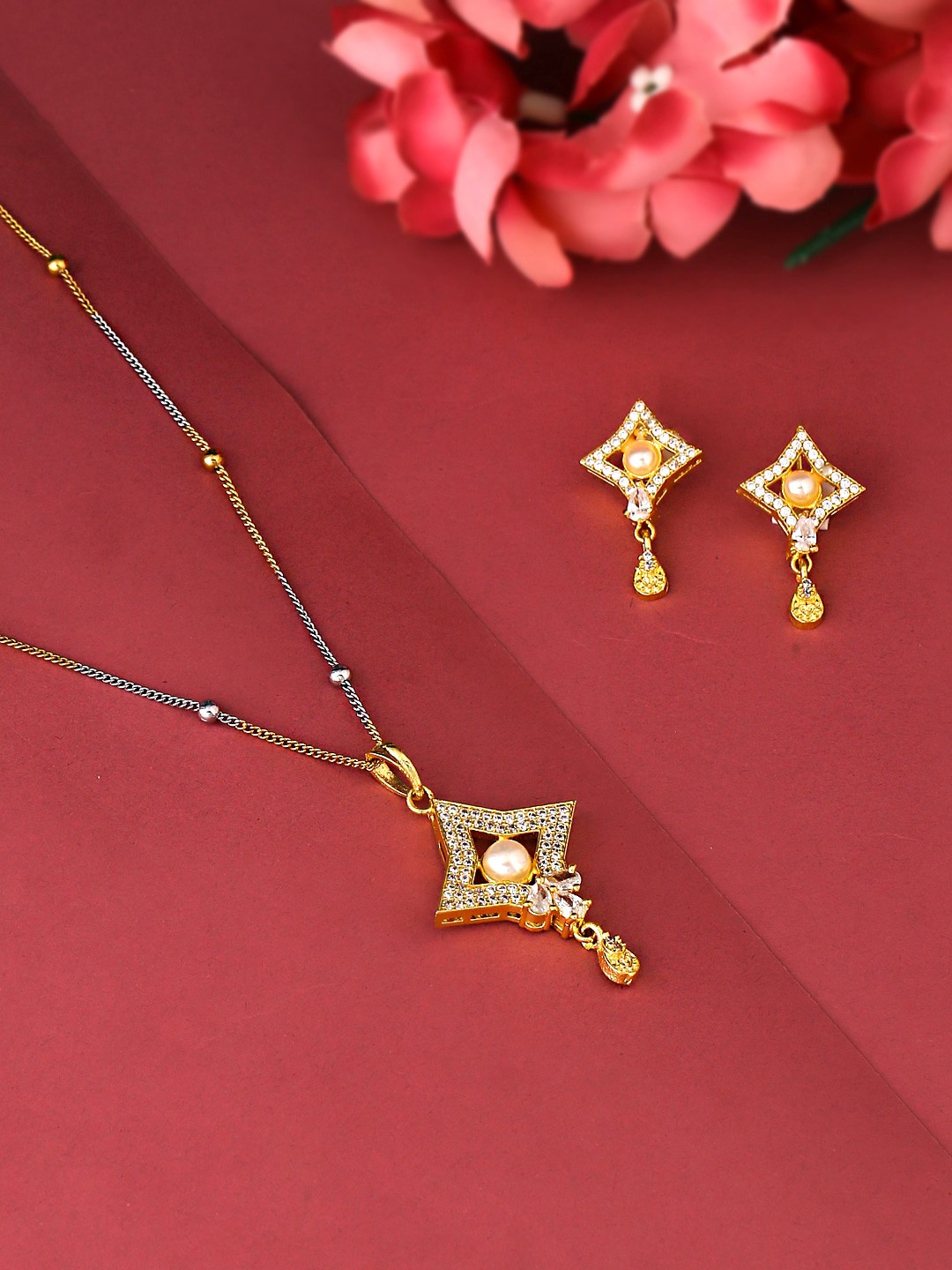 

Yellow Chimes Gold-Plated White Crystal Studded & Beaded Pendant With Earrings