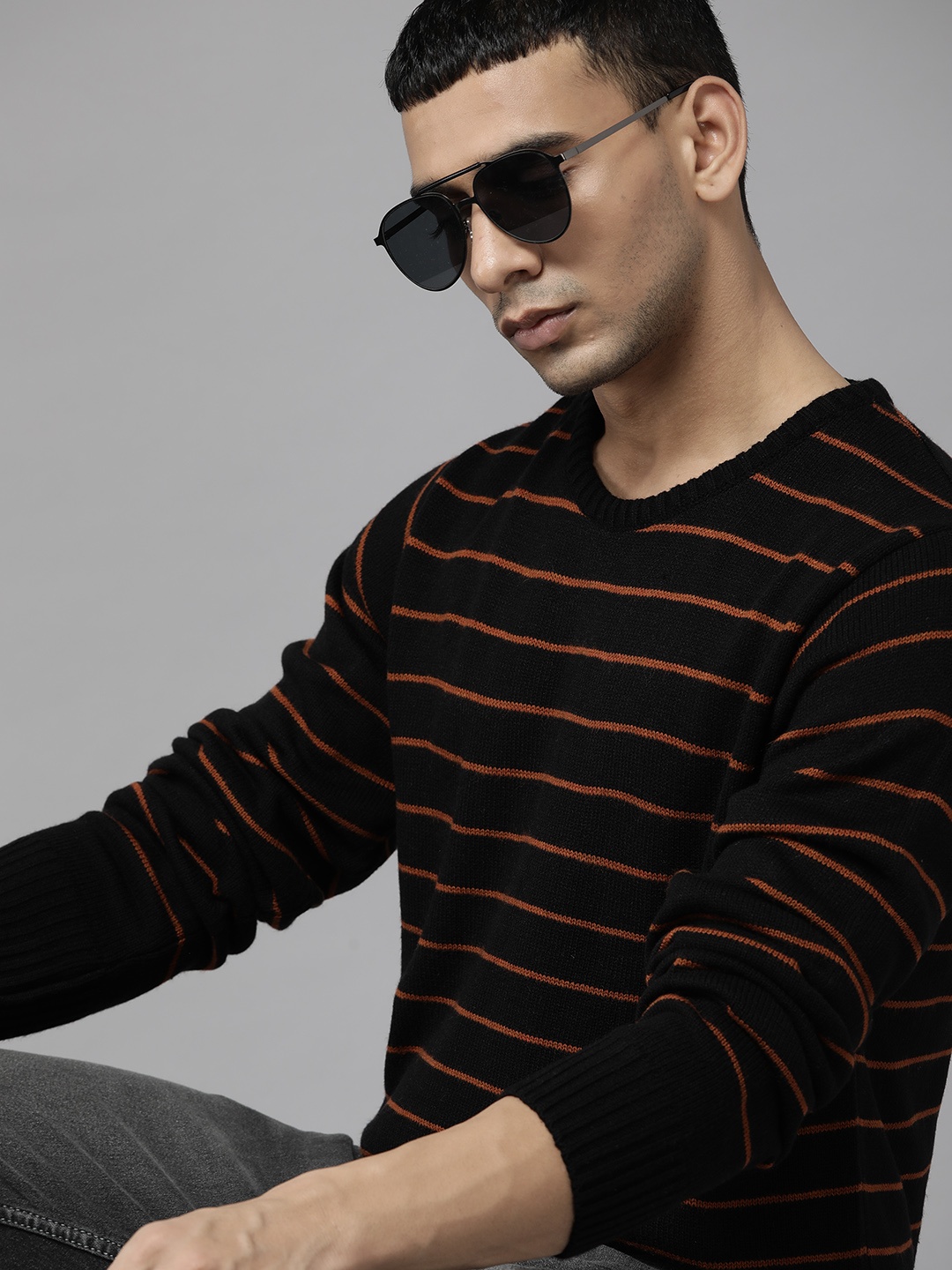 

Roadster Men Black & Rust Orange Striped Acrylic Pullover