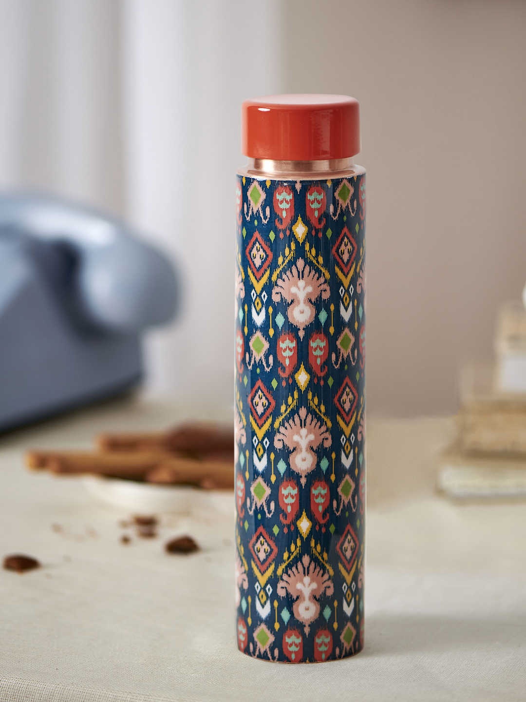 

Chumbak Teal Blue & Red Printed Indie Ikkat Copper Bottle
