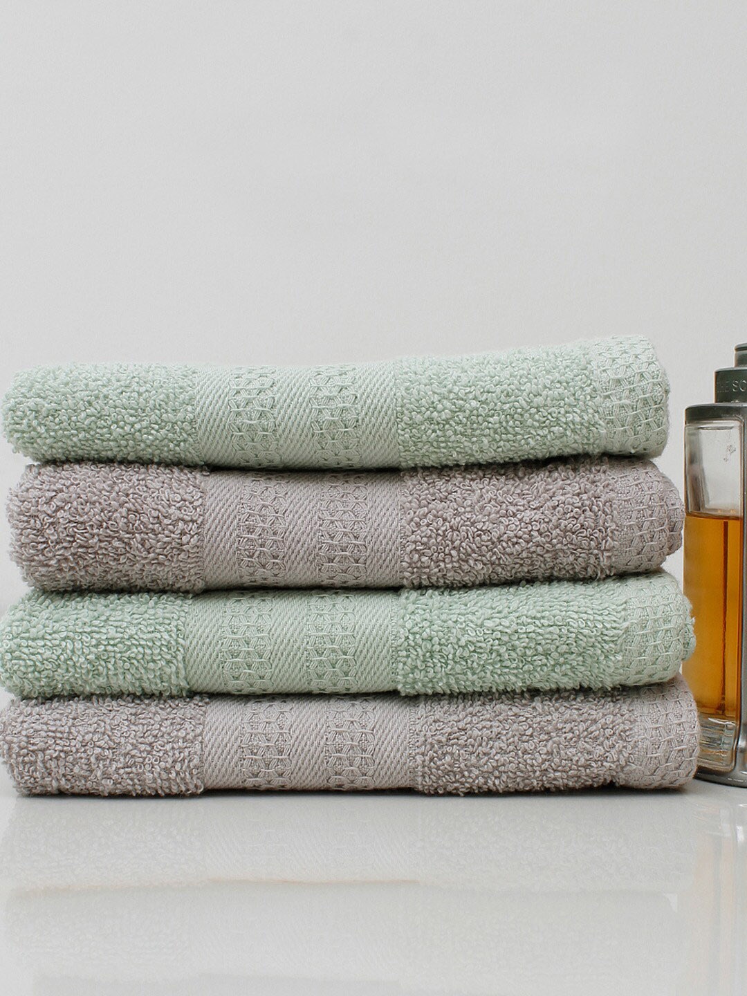 

AVI Living Set Of 4 Grey & Green Solid 450 GSM Pure Cotton Hand Towels