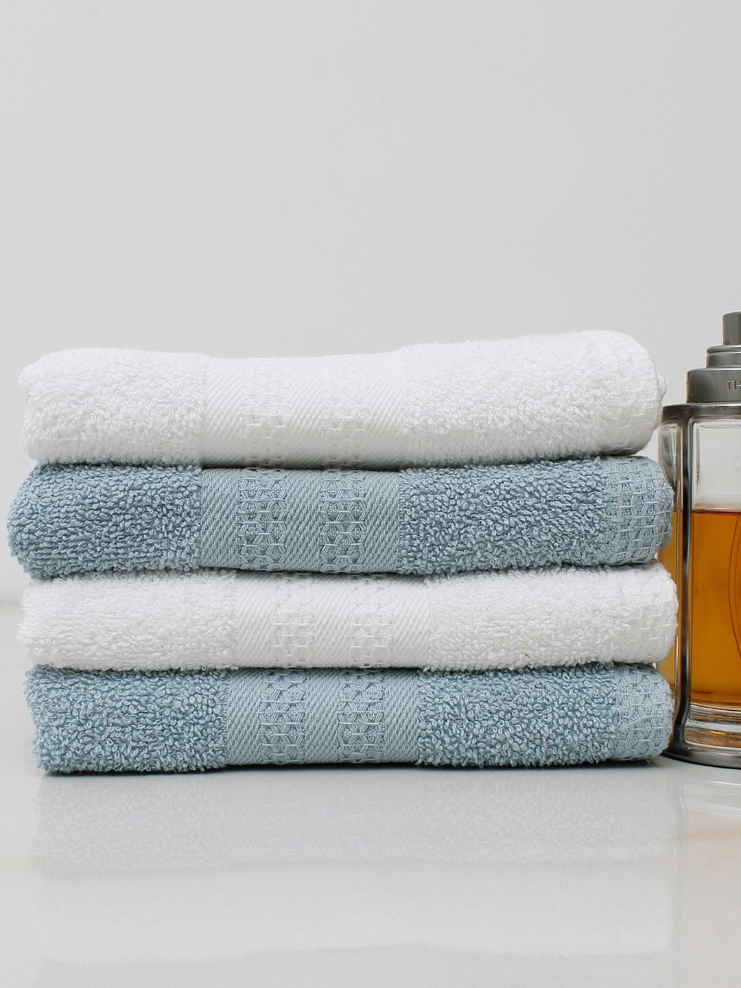 

AVI Living Set of 4 White & Blue Solid 450 GSM Pure Cotton Hand Towels