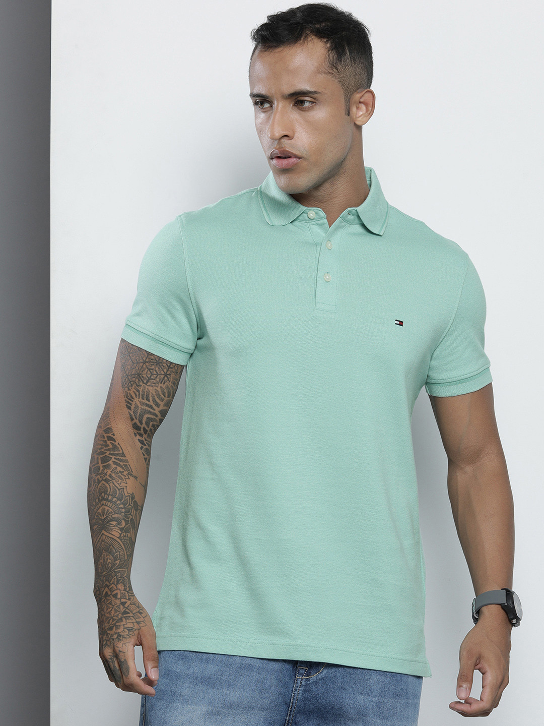 

Tommy Hilfiger Men Green Solid Polo Collar Indigo Organic Cotton Slim Fit T-shirt