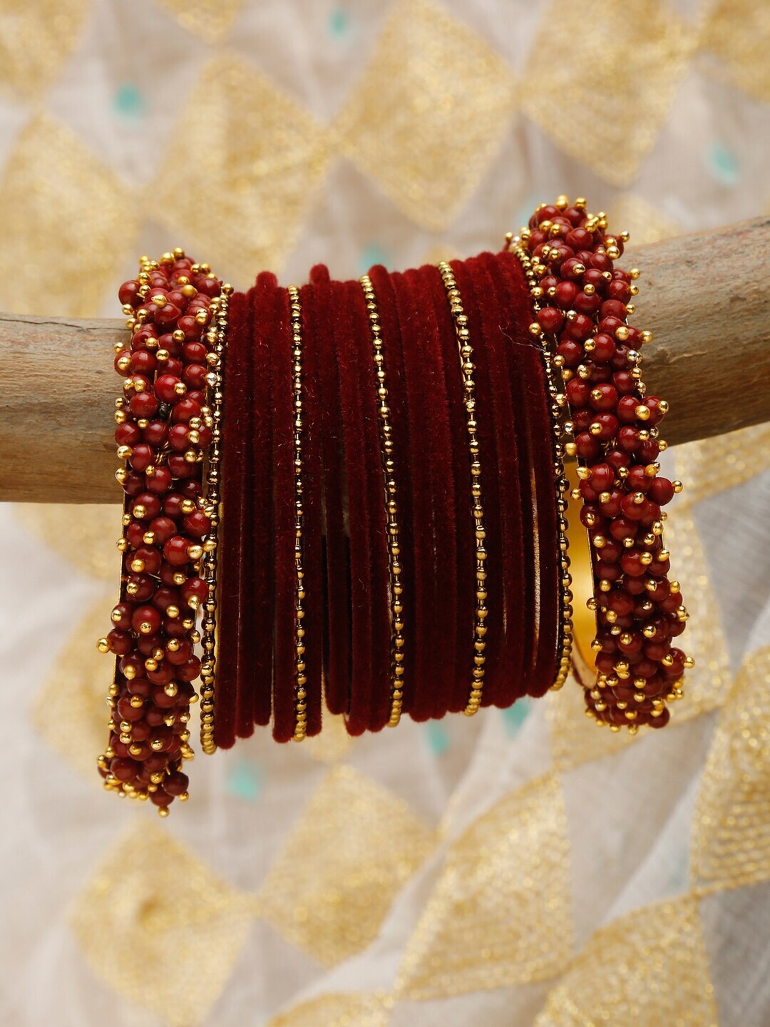 

Shining Diva Set Of 23 Gold-Plated Maroon Stone-Studded & Beaded Bangles