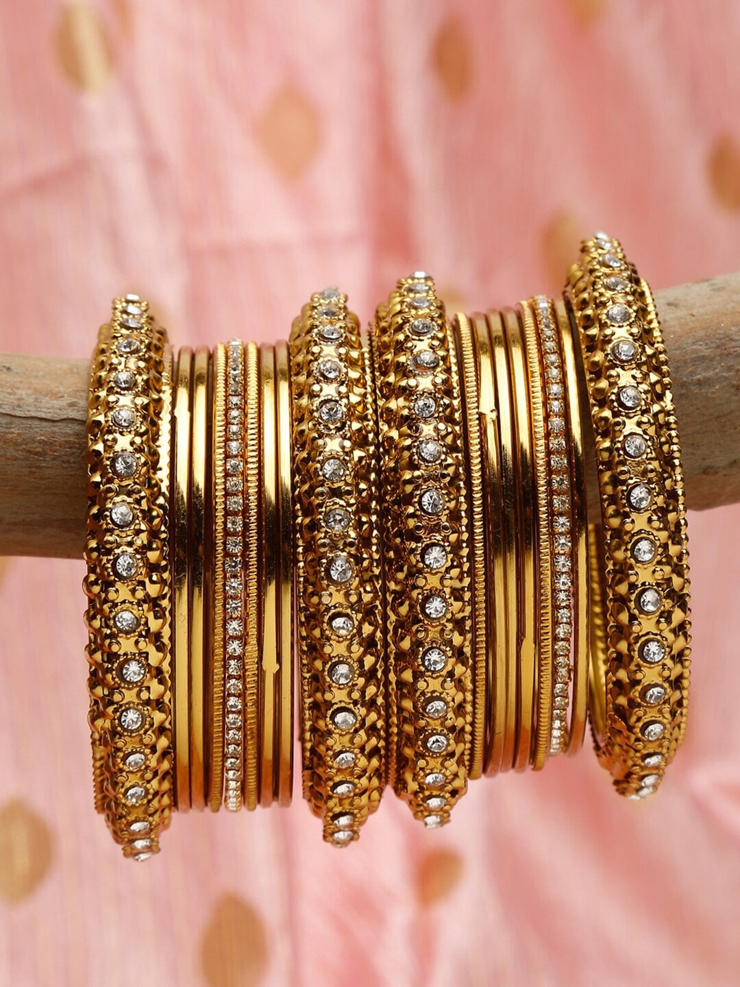 

Shining Diva Set Of 18 Gold Plated Gold Crystal Studded Bangle Set