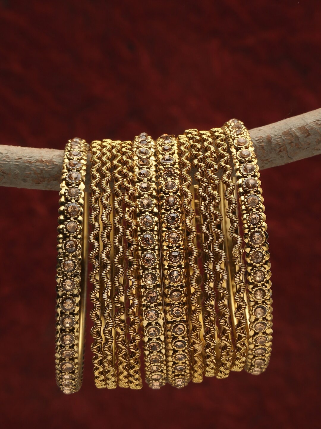 

Shining Diva Set Of 12 Gold Plated Gold Crystal Studded Bangle Set