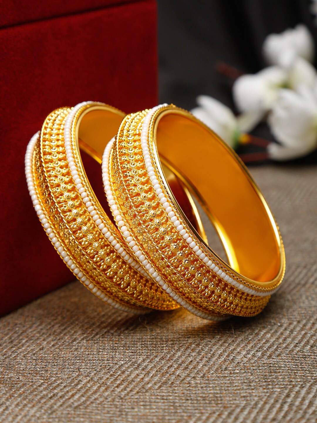 

Shining Diva Set Of 2 Gold Plated White Pearl Studded Bangle Set