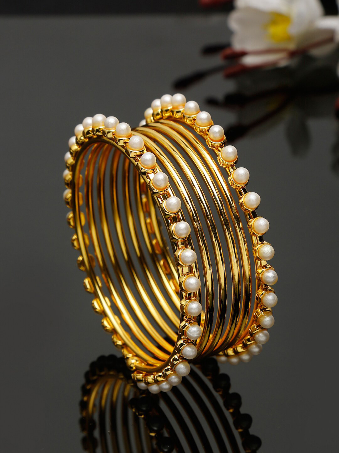 

Shining Diva Women Gold Plated White Pearl studded Bangles