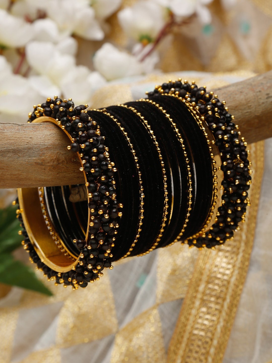 

Shining Diva Set Of 23 Gold-Plated Black Beaded Bangles