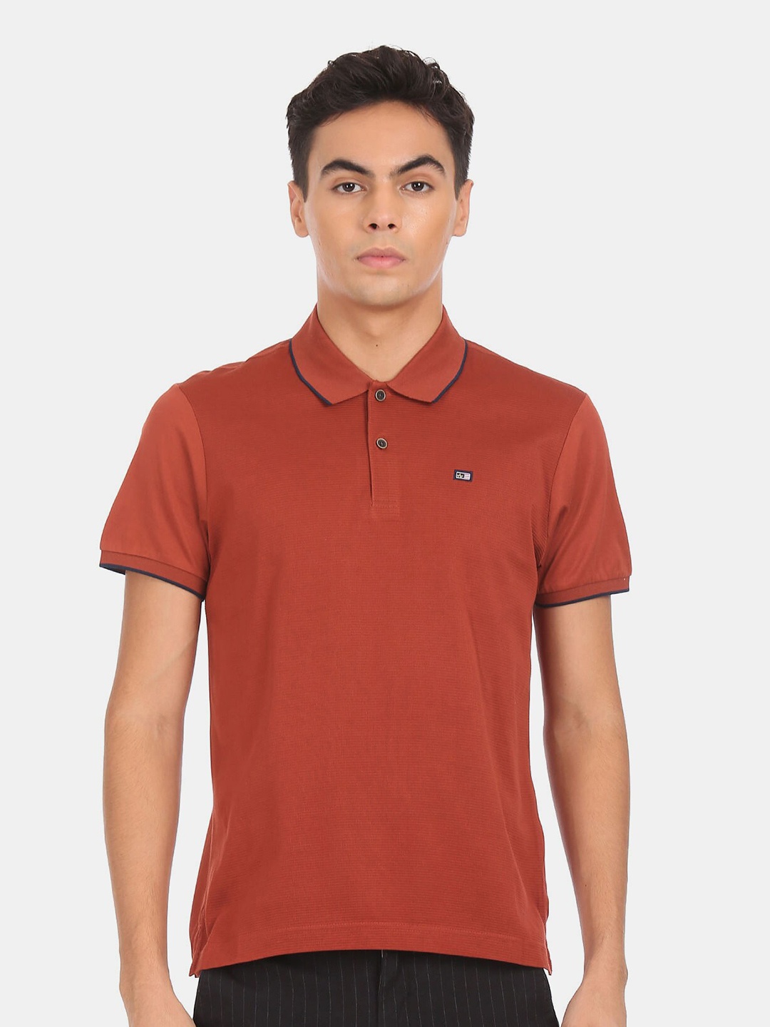 

Arrow Sport Men Rust Solid Polo Collar Cotton T-shirt