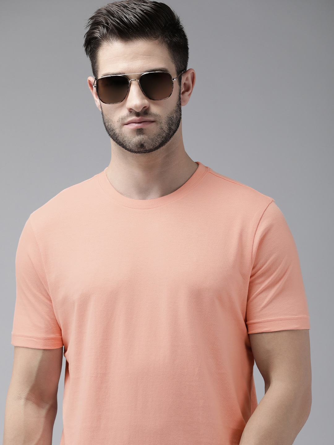 

Roadster Men Coral Orange Solid Pure Cotton T-shirt