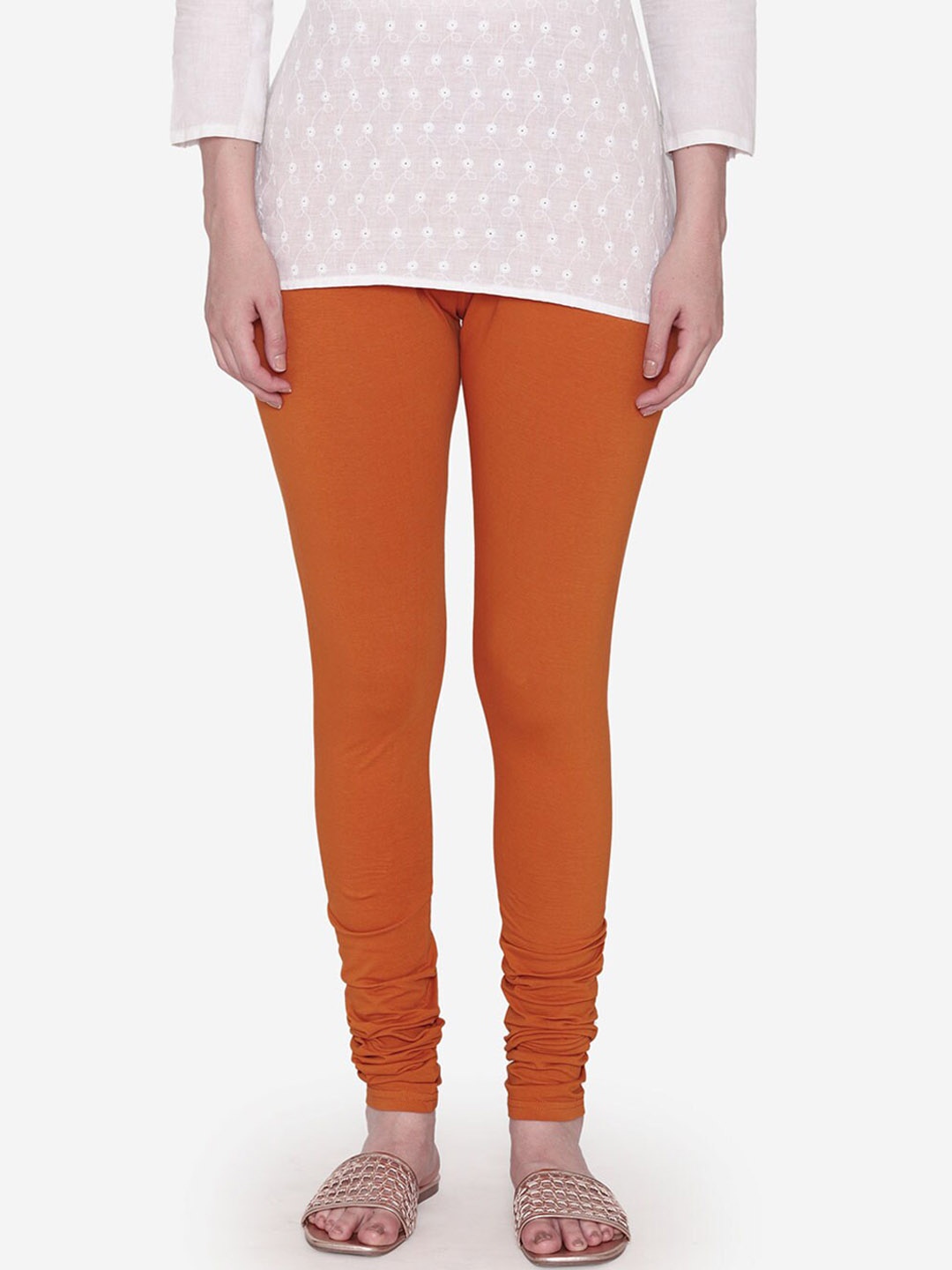 

Vami Women Orange Solid Churidar-Length Leggings